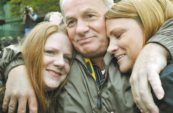 Ivan Henry with his daughters upon his acquittal and release from prison in 2010